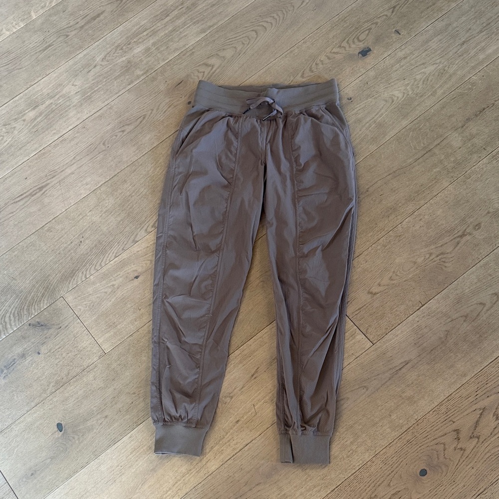 lululemon dance studio jogger in a mauve/tan color shows more grey in photo